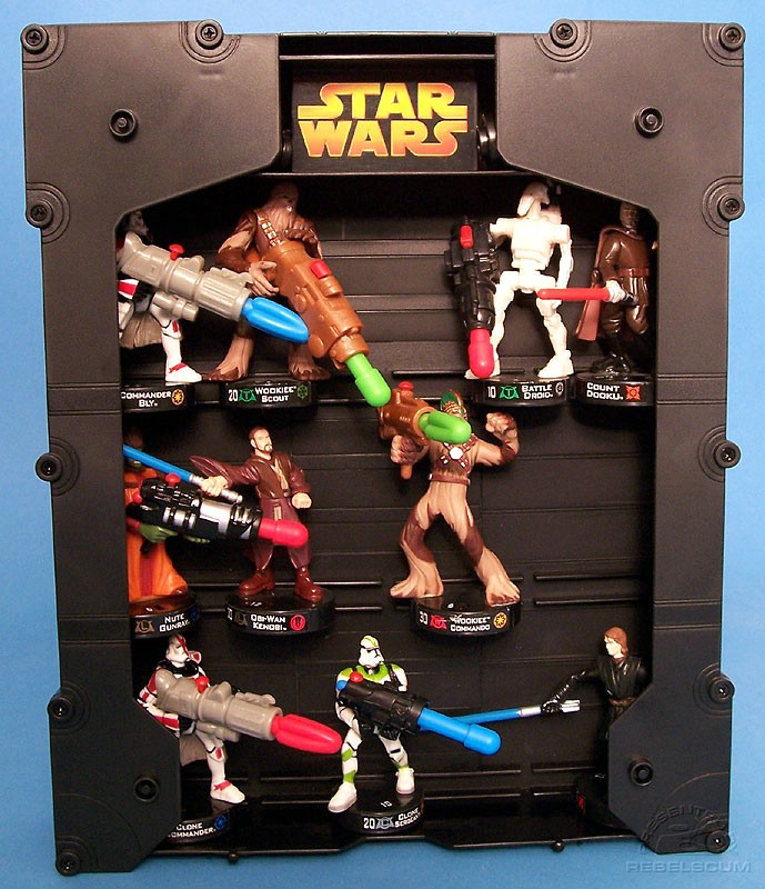 Bases of figures slide into slots on case