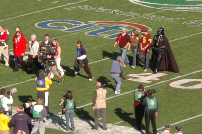 George walks onto the Rose Bowl field to toss the coin