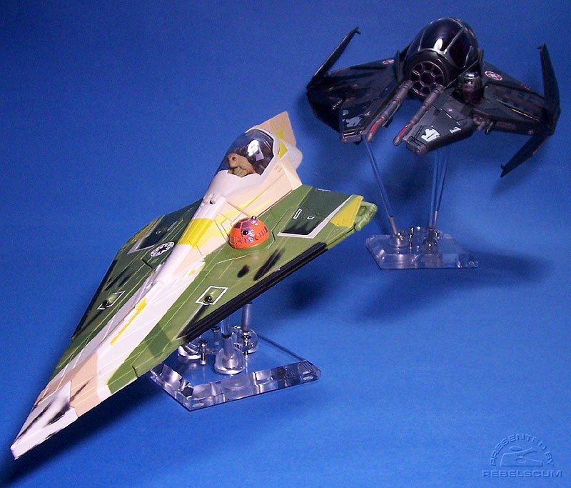 Darth Vader's Sith Starfighter (on a 6'' stand) pursues Kit Fisto's Jedi Starfighter (on a 2.5'' stand)